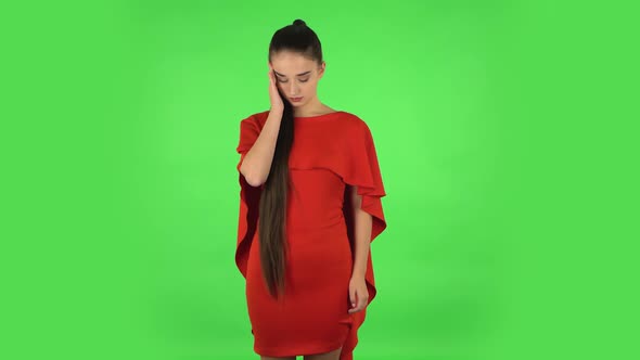 Pretty Young Woman Is Suffering From Headache From Fatigue. Green Screen