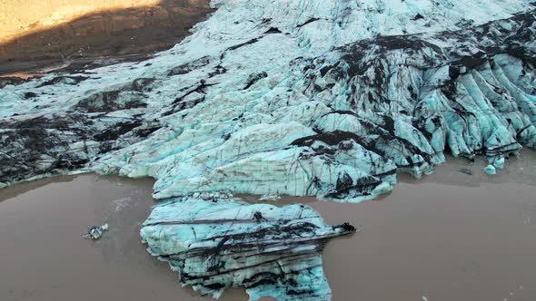 Drone Over Blue Glacier In Lagoon Of Sunny Landscape