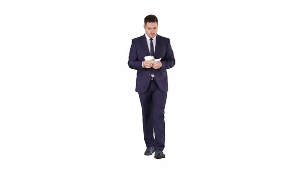 Man in Suit Walking and Counting Money on White Background.