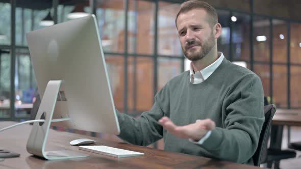 Handsome Man Getting Upset While Working on Computer