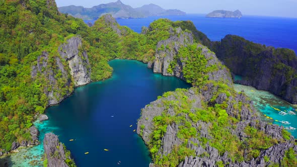 Rocky Mountains with Big Lagoon on Background Turquoise Ocean in El Nido, Palawan, Philippines