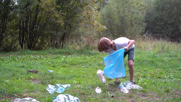 Children Remove Plastic Garbage and Put It in a Biodegradable Garbage Bag in the Open Air