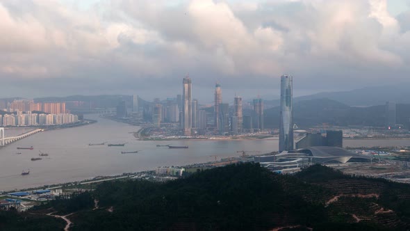 Macau – Zhuhai Border Earial Cityscape Day Timelapse Pan Up