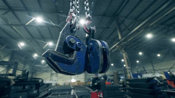 Clamping Devices Are Hanging in a Metalware Plant Unit