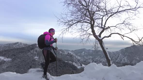 Trekking With Lots Of Snow With Snowshoes. A Girl Alone