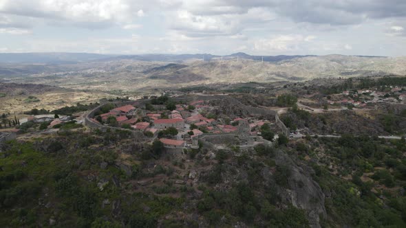 Approaching Sortelha historic medieval landmark and castle of Portugal. Aerial view