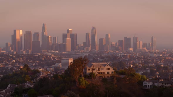 Residential houses and city skyline at sunset