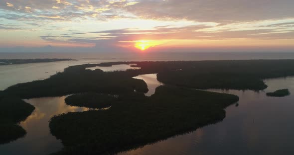 Sunset and Clouds Reflecting on Water by Jupiters Island