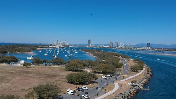 Aerial view of a busy day on popular waterway with a city skyline in the distance