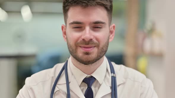 Cheerful Young Doctor Smiling at the Camera