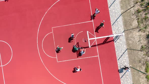 Aerial View of Young Athletes Throwing the Ball Into the Basketball Basket