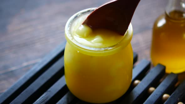 Homemade Ghee in Container on a Table 