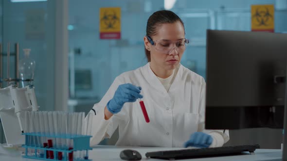 Chemistry Researcher Looking at Substance in Test Tube