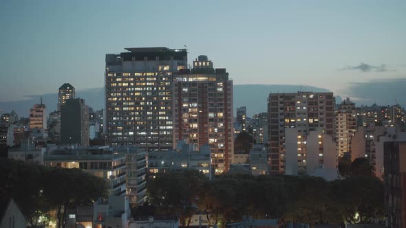 Day to night time lapse view of high rise buildings