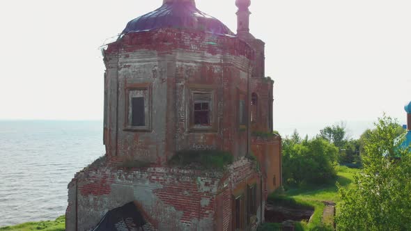 Old Dilapidated Christian Church Near the River