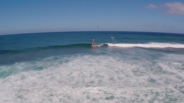 Aerial view of a man windsurfing in Hawaii