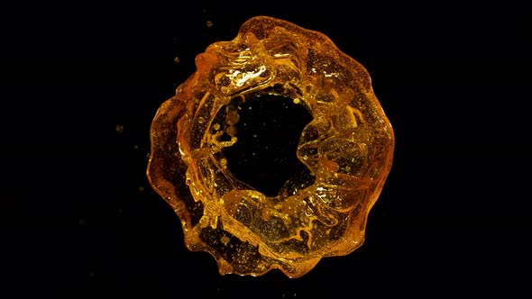 Super Slow Motion Shot of Rotating Oil Whirl Isolated on Black Background at 1000Fps