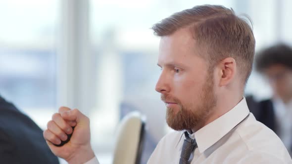 Businessman Using Hand Expander