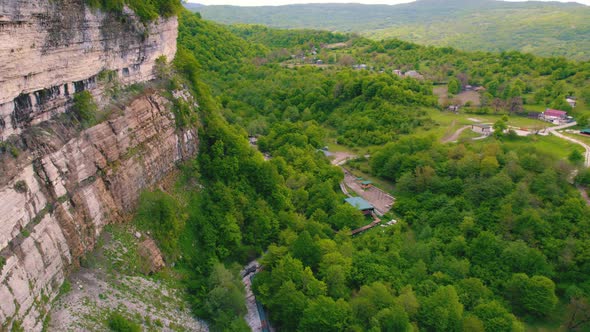 Aerial Shot of Okatse Canyon with Vertical Steep Walls and River at the Bottom Georgia Europe