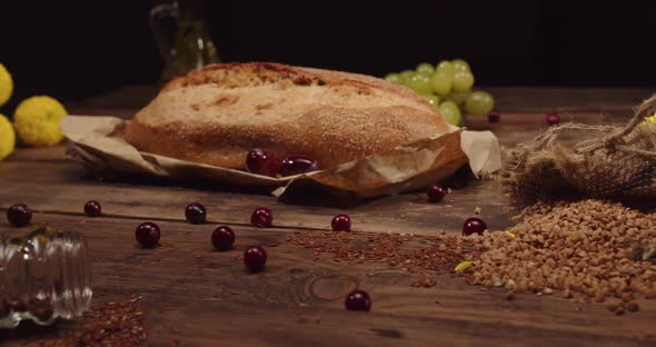 Homemade Fresh Buckwheat Bread With Flax Stands On A Wooden Table