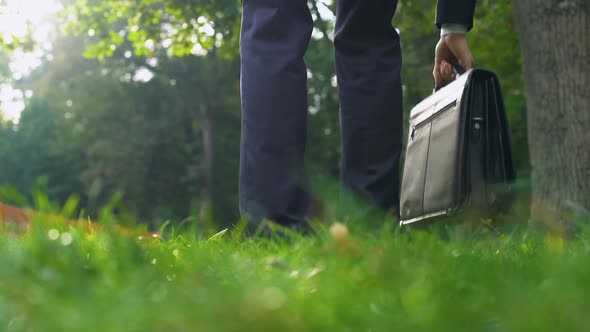 Man in Suit Leaving His Case on Grass and Happily Running Into Forest, Freedom