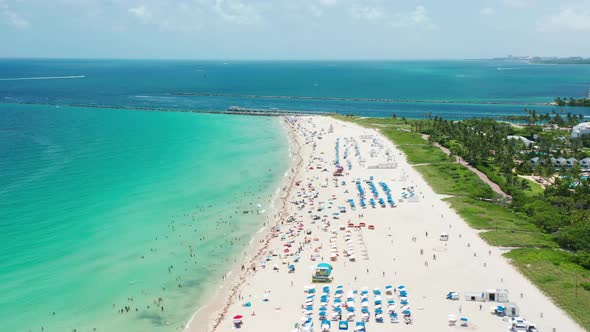 Cinematic Aerial of the Tropical Beach at the Coastal City Green Atlantic Ocean