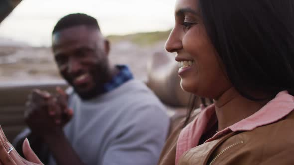 African american couple hugging each other while sitting in the convertible car