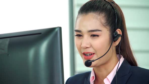 Business People Wearing Headset Working in Office