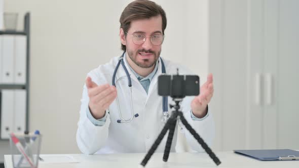 Young Male Doctor Recording Video Smartphone