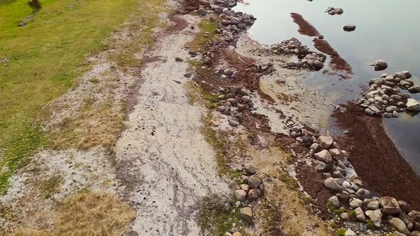 Aerial view of empty rocky beach in Formby on the island of Vormsi in Estonia.