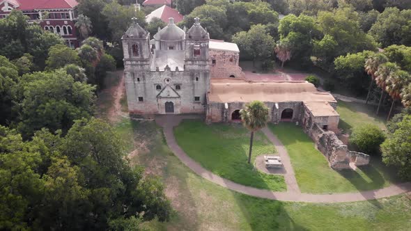 A drone flies over the beautiful grounds of Mission Concepcion in San Antonio, Texas