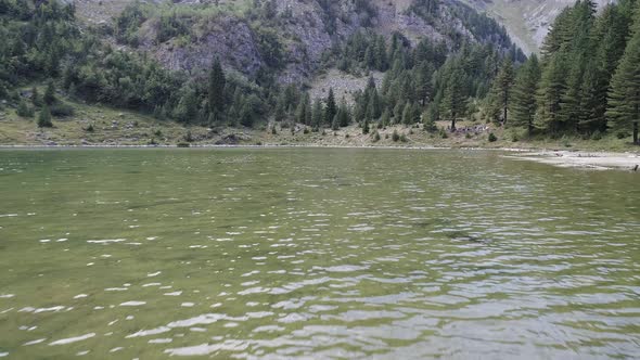 Flying over Lake of Rugova and Towards the Rugged Mountains