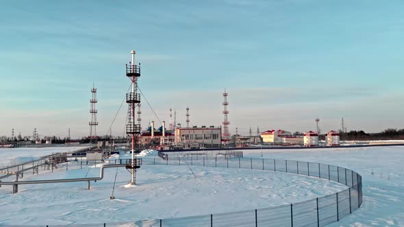 Drone Flying Over an Oil and Gas Production Facility in Winter