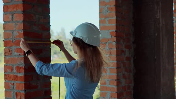 Civil Engineer Checking Construction Site. Woman Architect In Helmet Inspecting Building.