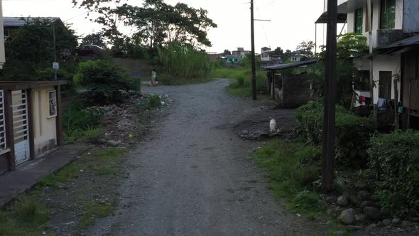 Following a dirt road in a small South American neighbourhood