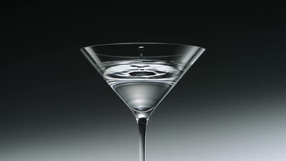 Water drop in martini glass, Slow Motion