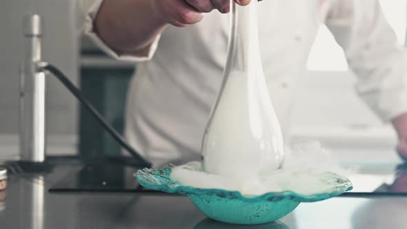 Fine Restaurant Chef Smoking a Plate with Sophisticated Kitchen Utensils in Slow Motion