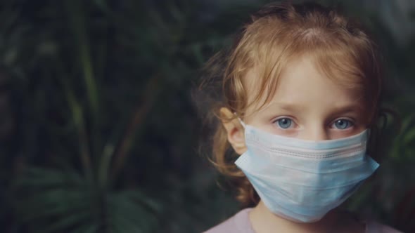 Little Girl in a Medical Mask.