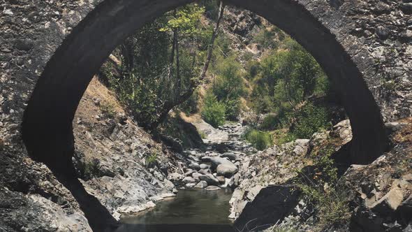 Ancient Stone Old Bridge in Wild Historical Medieval Park on Tour Excursion in Europe