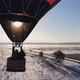 Aerial Shot of the People Fly on a Big Bright Balloon Over the Winter Forest - VideoHive Item for Sale
