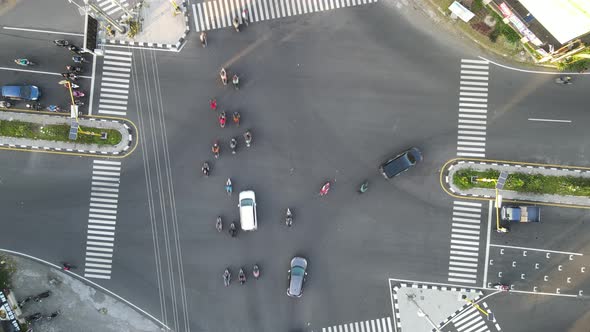 Drone shot on the street with intersections and cars.