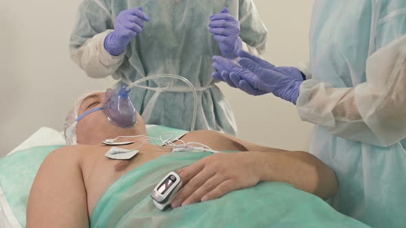 Doctors are Preparing for a Medical Examination of a Male Patient