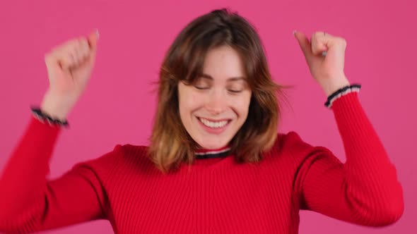 Close Up of a Girl That is Celebrating Surprised and Amazed for Success with Arms Raised