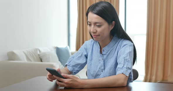 Woman Work on Cellphone at Home