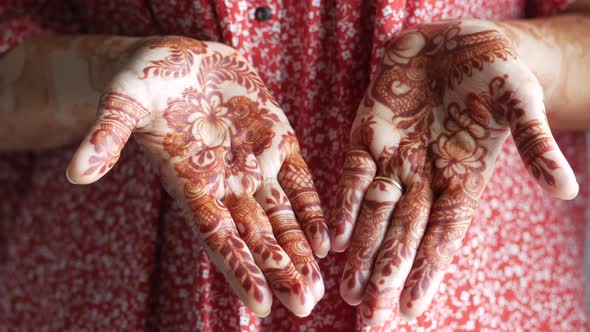 Women Applying Henna on Hand