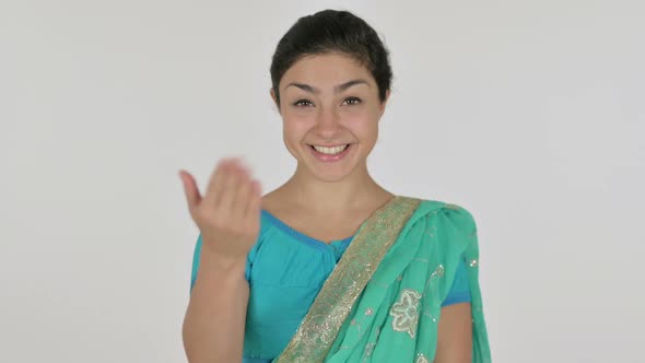 Indian Woman Pointing at the Camera and Inviting White Background