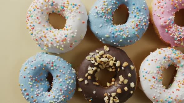 Video of donuts with icing on white background