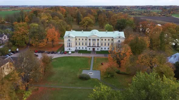 Autumn Aerial Landscape of the City Mezotne and Palace With Park Near Lielupe River, Latvia 4K Video