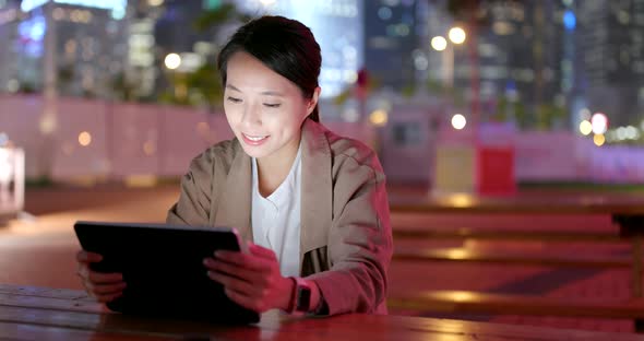 Asian business woman working on tablet computer