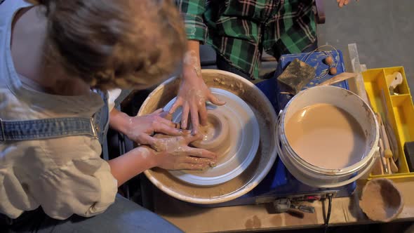 Slow Motion, Woman Works with Pottery Wheel in a Workshop